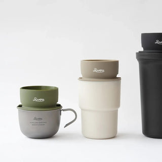 Set of stackable travel mugs in various colors on a white background